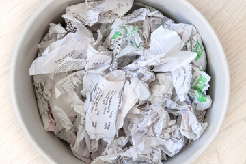 Cash sales check sorted for recycling. Cashier's receipts for recycle. Waste to be recycled.