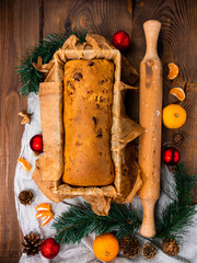 Christmas cake baking rolling pin rustic wooden background flat lay. Dough recipe ingredient eggs wholegrain flour milk butter sugar on festive vintage wood table from above. Top view kitchen layout