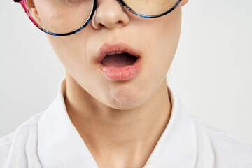 women in white shirt glasses posing color background