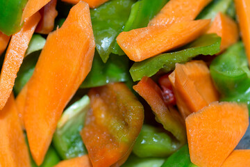 background vegetable salad of carrots and peppers