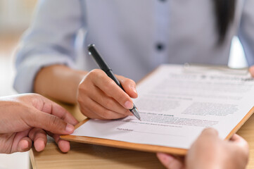 Male and female employees working together in the workplace
