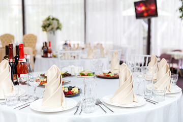 Luxury table setting for dining in pastel colors close up 