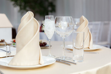 Luxury table setting for dining in pastel colors close up 