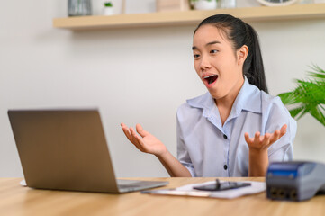 female employee working with laptop