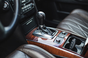 Obraz na płótnie Canvas Detail of modern car interior, gear stick, automatic transmission in expensive car