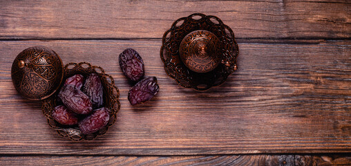 Dried dates fruit and coffee. Popular fruit of Ramadan.