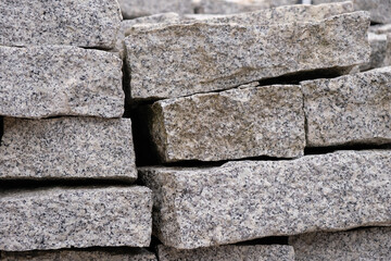 Gray granite slabs. Sawn chipped granite. Stacked for sale. 