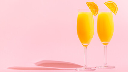Refreshing orange Mimosa cocktails with champagne.