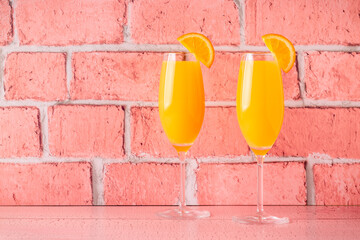 Refreshing orange Mimosa cocktails with champagne.