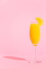 Refreshing orange Mimosa cocktails with champagne.