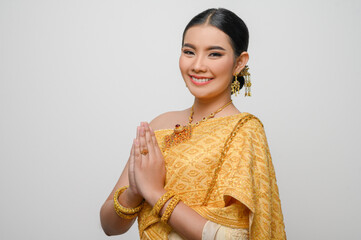 Beautiful Asian woman in traditional Thai dress costume white background
