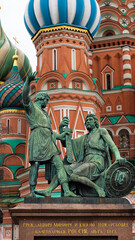 Fototapeta na wymiar Dmitry Pozharsky and Kuzma Minin monument in Moscow on the backgroung of St. Basil's Cathedral on Red Square. Heroes liberators of Russian history in 17 century. Vertical shot for Social Media