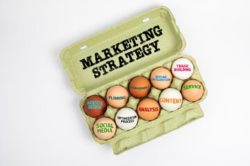 Obraz na płótnie Canvas Marketing Strategy. Chicken eggs in a cardboard box