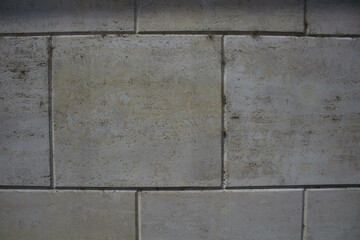 evocative image of granite wall with joints between tiles