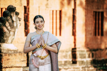 Asian charming woman wearing typical Thai dress identity culture