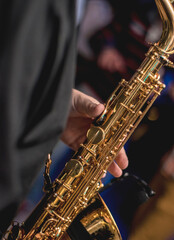 Fototapeta na wymiar Man plays saxophone at concert