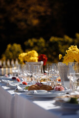 Table place setting with spring holidays decoration. Romantic dinner with candles