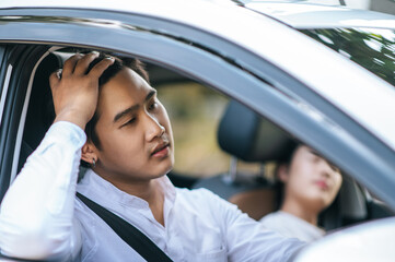 Women and men sit in cars and are stressed.