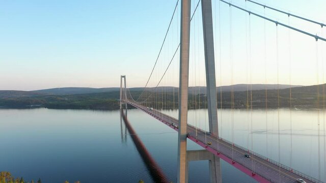 Aerial rising shot of the High Coast bridge in Northern Sweden UNESCO world heritage site