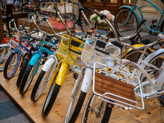 Moscow, Russia - October 5, 2021: GUM is the main department store. Bright colored modern bicycles in different sizes for adults and children are for sale. Selective focus.