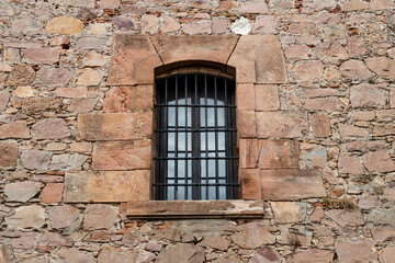 Fototapeta na wymiar Old rock wall with vintage window for texture