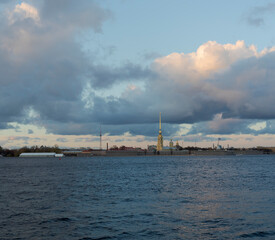 Panorama of the Neva River and the Peter and Paul Fortress. Beautiful clouds in the sunset sky. Saint-Petersburg, Russia.