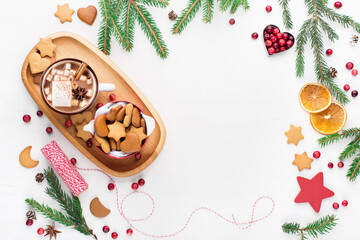 Christmas gift cookies and cup of hot chocolate. Flat lay winter cozy Christmas holiday background. Xmas atmosphere.