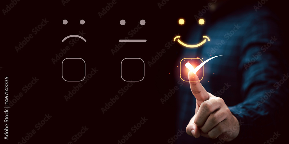 Poster businessman touching virtual touch screen to select smiley face emotion button for the best evaluati
