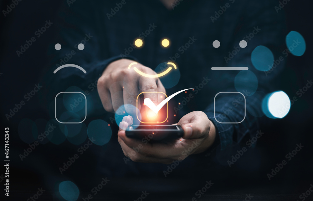Poster businessman touching virtual touch screen to select smiley face emotion button for the best evaluati