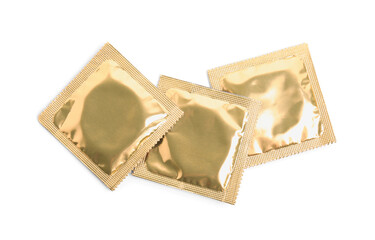 Condom packages on white background, top view. Safe sex