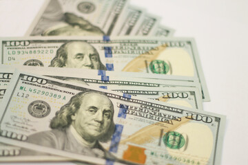 Stacks of paper 100 dollars USA on the white background