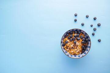  cereal breakfast and blue berry in bowl on table 