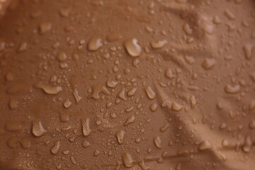 the remaining rainwater on the raincoat that looks neat and good for the background