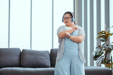 Autistic girl exercises and sings happily at home.