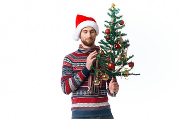 Cheerful man in a santa hat Christmas decorations holiday New Year isolated background