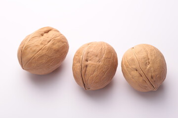walnuts in the peel close-up on a white background
