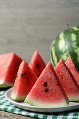 Delicious fresh watermelon slices with seeds on table