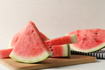 Delicious fresh watermelon slices on white table