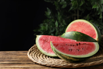 Delicious fresh watermelon slices on wooden table. Space for text