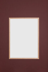 Blank frame hanging on dark wall. Space for design