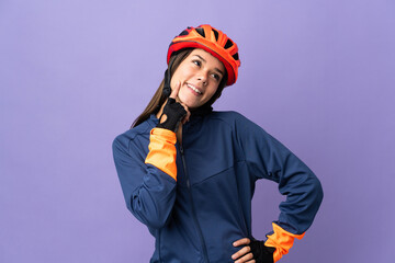 Teenager cyclist girl thinking an idea while looking up