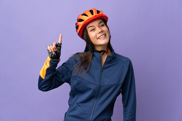 Teenager cyclist girl showing and lifting a finger in sign of the best