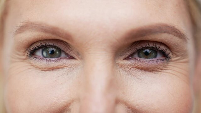 Cropped face retired lady eyes look camera enjoy relaxing effect