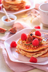 Sweet curd cheese pancakes with fresh raspberry, figs and maple sirup