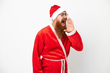 Reddish man disguised as Santa claus isolated on white shouting with mouth wide open to the side