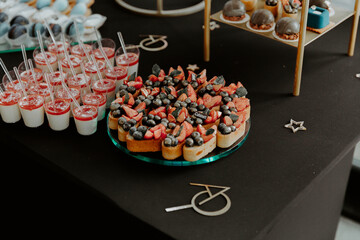 candy bar. cakes with fruit for a birthday party
