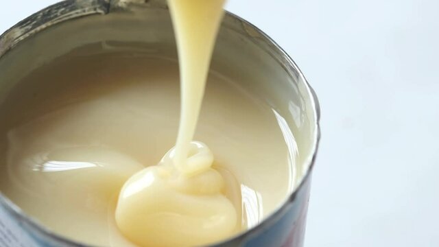 condensed milk in a bowl close up,