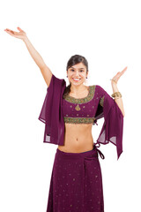 Beautiful indian young brunette dancing