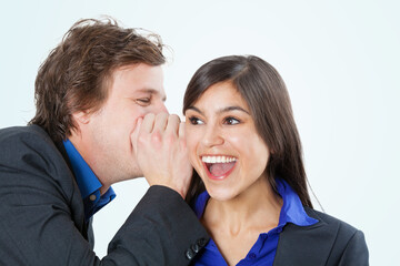 Business colleagues sharing a secret