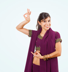 Beautiful indian young brunette dancing